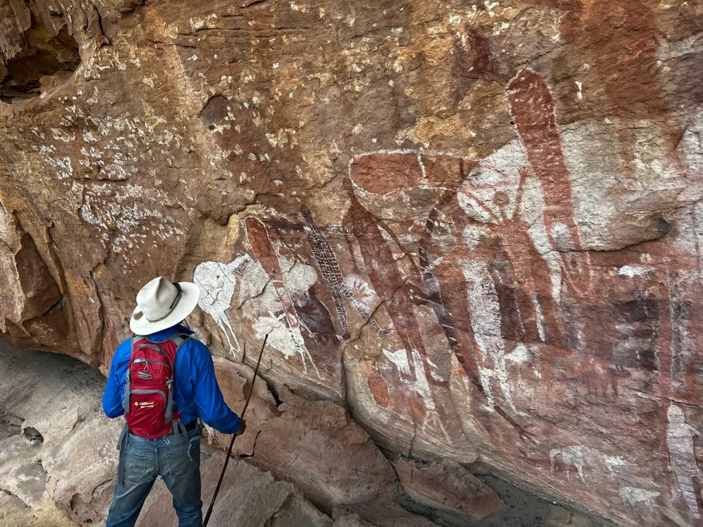 Guide overlooking Quinkan rock art outside of Laura, Queensland