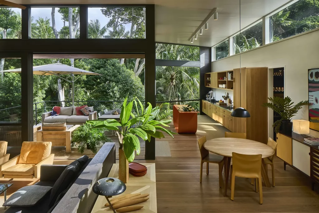 Interior of Island House South Villa, featuring open plan living and views over Kentia palms and banyan trees