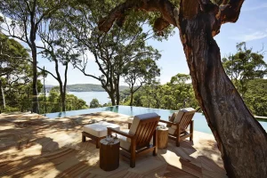 Pool loungers overlooking scenic bush landscapes on the Bouddi Peninsula