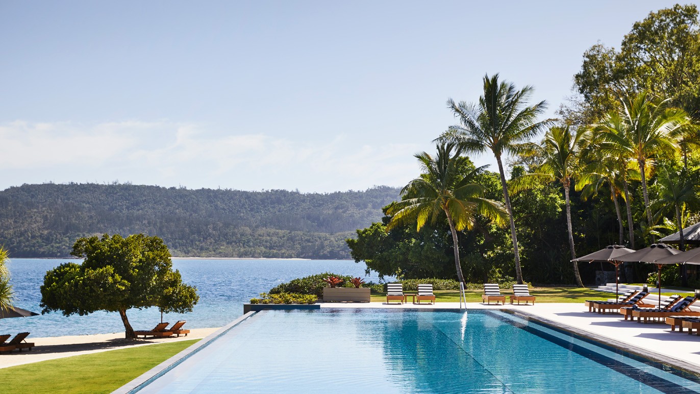 Island resort pool looking over a bay 