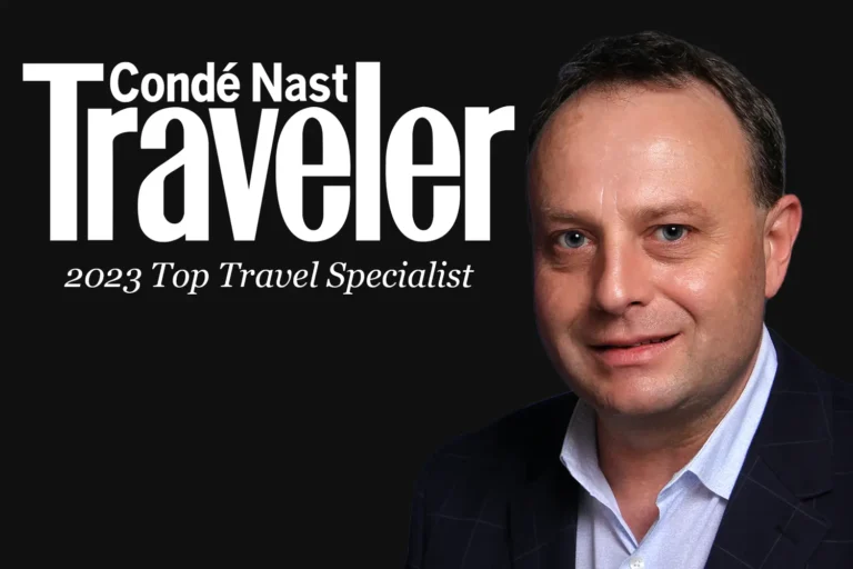 Drew Kluska with Condé Nast Traveler logo behind him