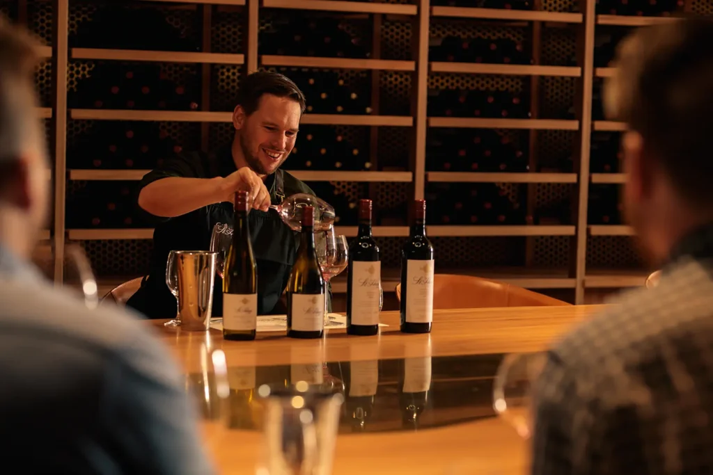 The Host transferring wine between glasses during Riedel Masterclass at St Hugo Winery, Barossa Valley, SA