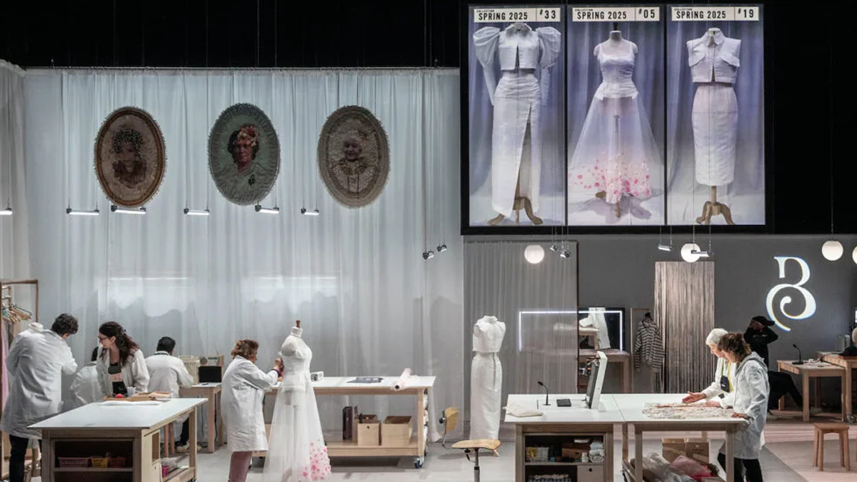 A theatre stage with a scene from a play about Paris fashion houses 