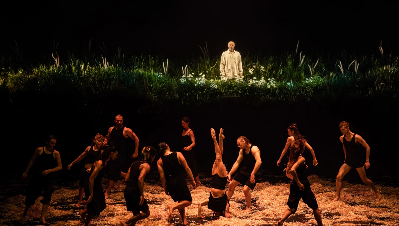 Dramatic dance performance on stage.